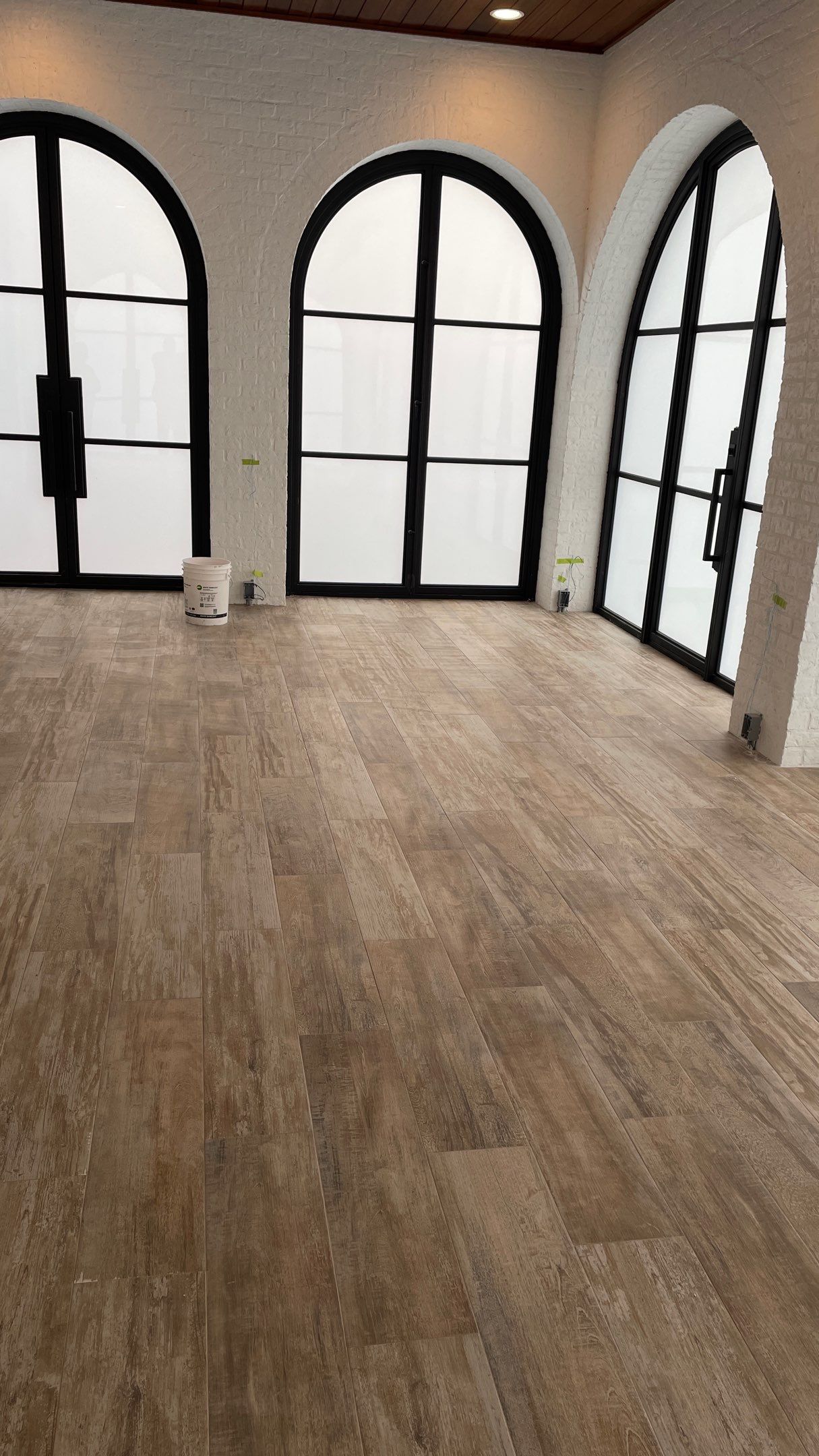 Instant Transformation of this Beautiful Sunroom by Footprints Floors of Coastal Carolina