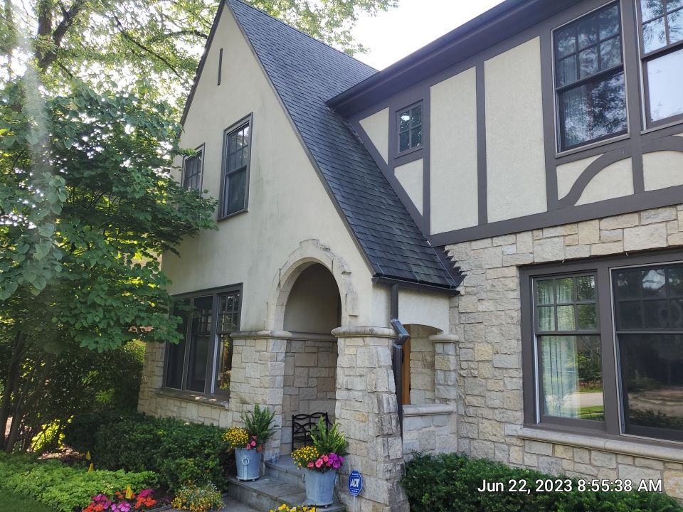 Northbrook, IL stucco home soft wash and stone cleaning by Northern Power Washing LLC.