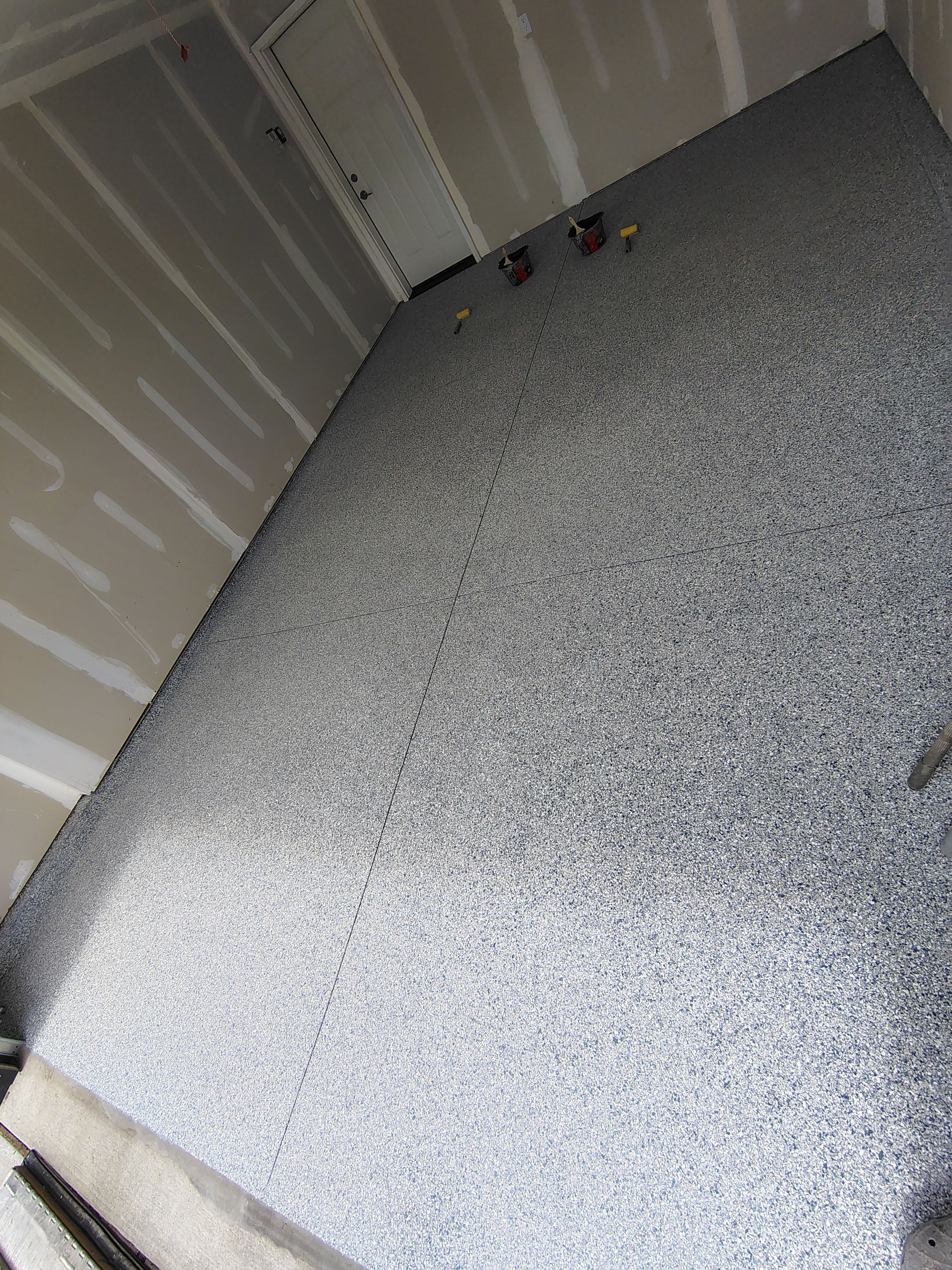 Custom Epoxy Garage Floor Coating Installation in Sioux Falls by Select Painting, Coatings & Garage Cabinets
