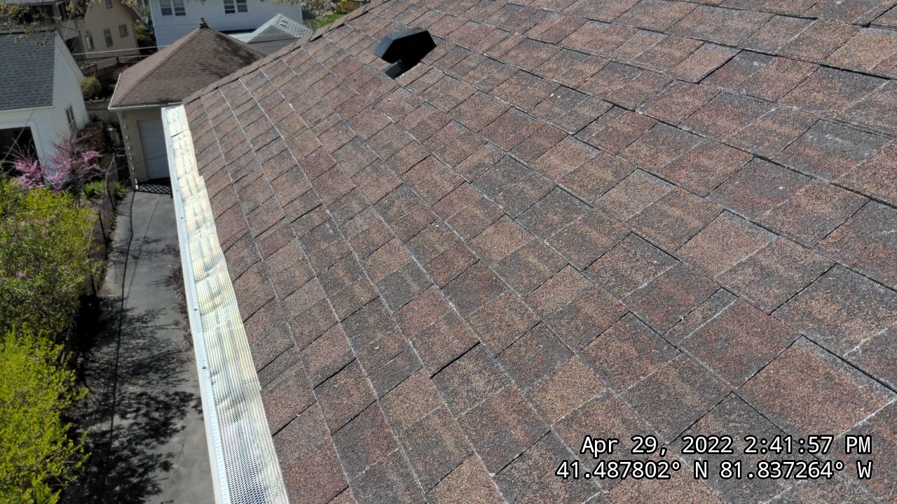 Residential Roofing Installation, Dec-tek walk-out porch roof, siding on garage by Absolute Roofing and Construction