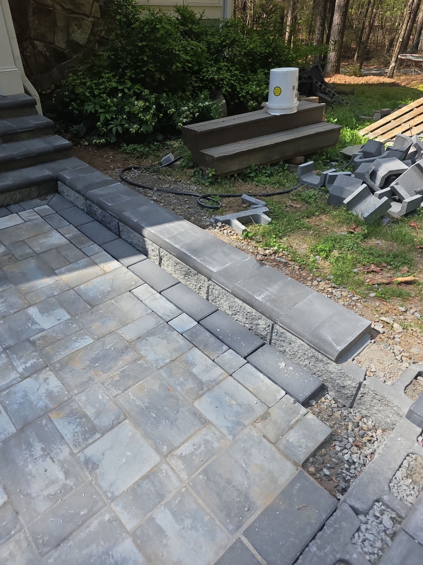 Pittsboro Outdoor Living Transformation – Retaining Wall, Paver Patio & Elevated Deck by Elite Remodeling and Design LLC