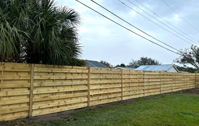 Wood Fence Installation using 6Ft Tall Pressure Treated Wood Privacy Fence