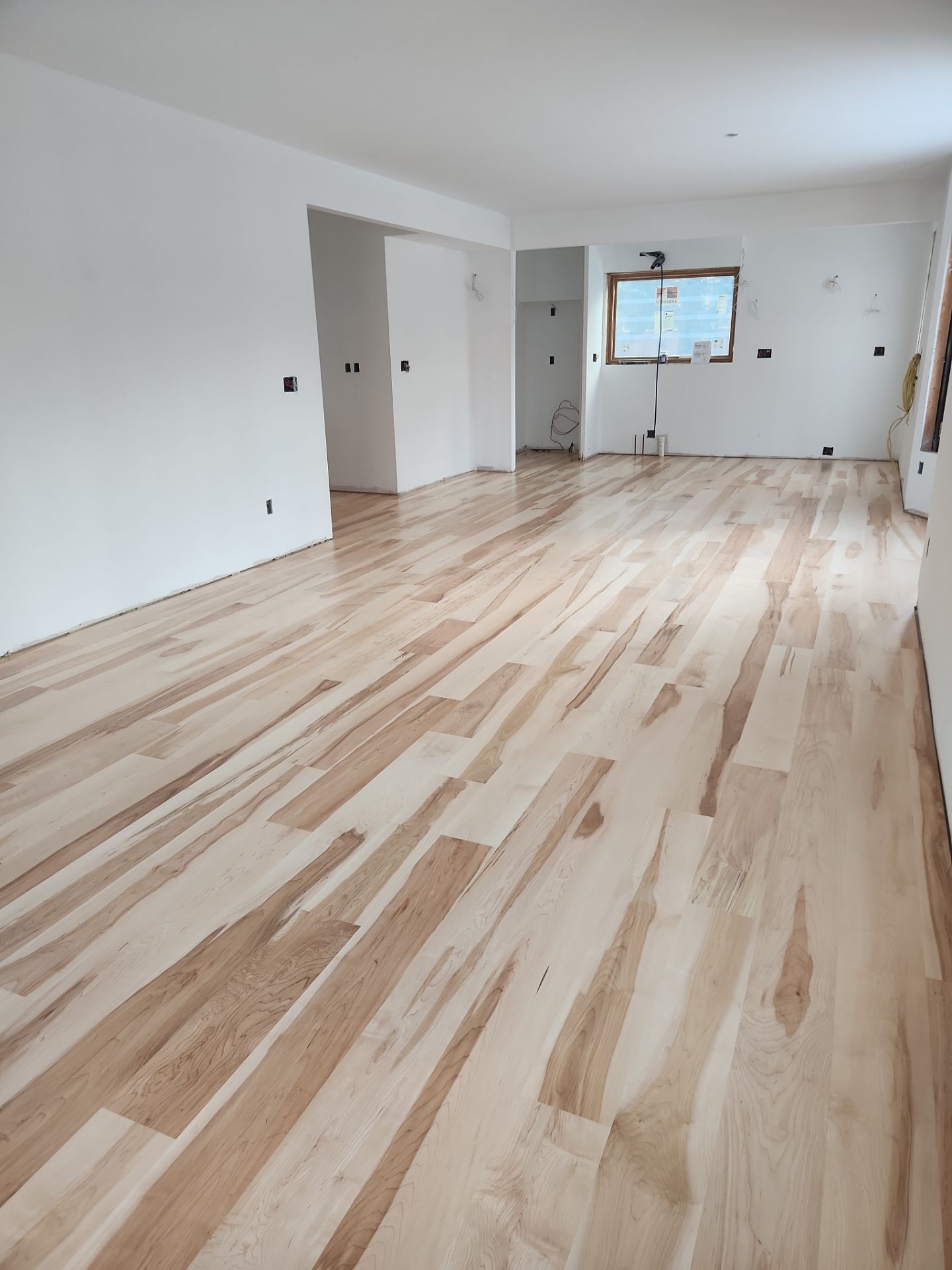 Full glue down Installation over radiant heat 7" Maple character grade by Ann Arbor Hardwoods 