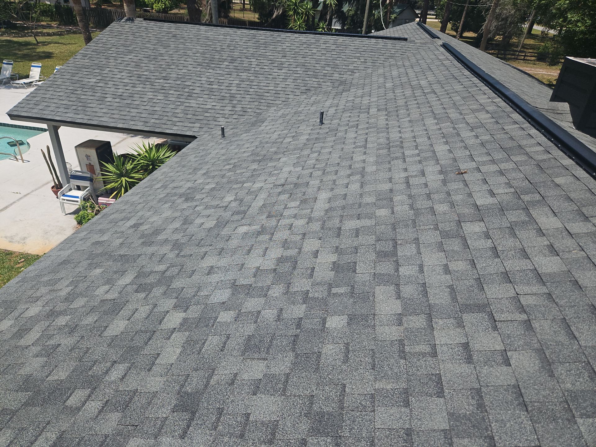Roof Replacement with Architectural Shingles and Chimney Repair in Cocoa by Wiedmann Construction & Roofing