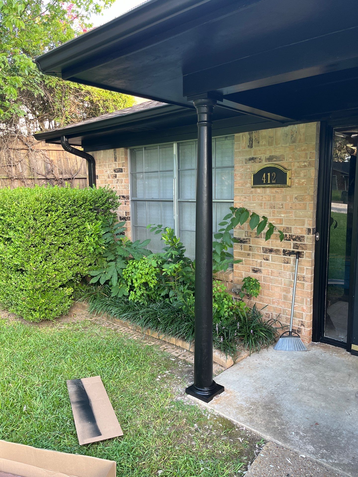 Exterior Painting in Tyler, TX | Eaves, Door & Columns in Elegant Black by Quality Coats Painting