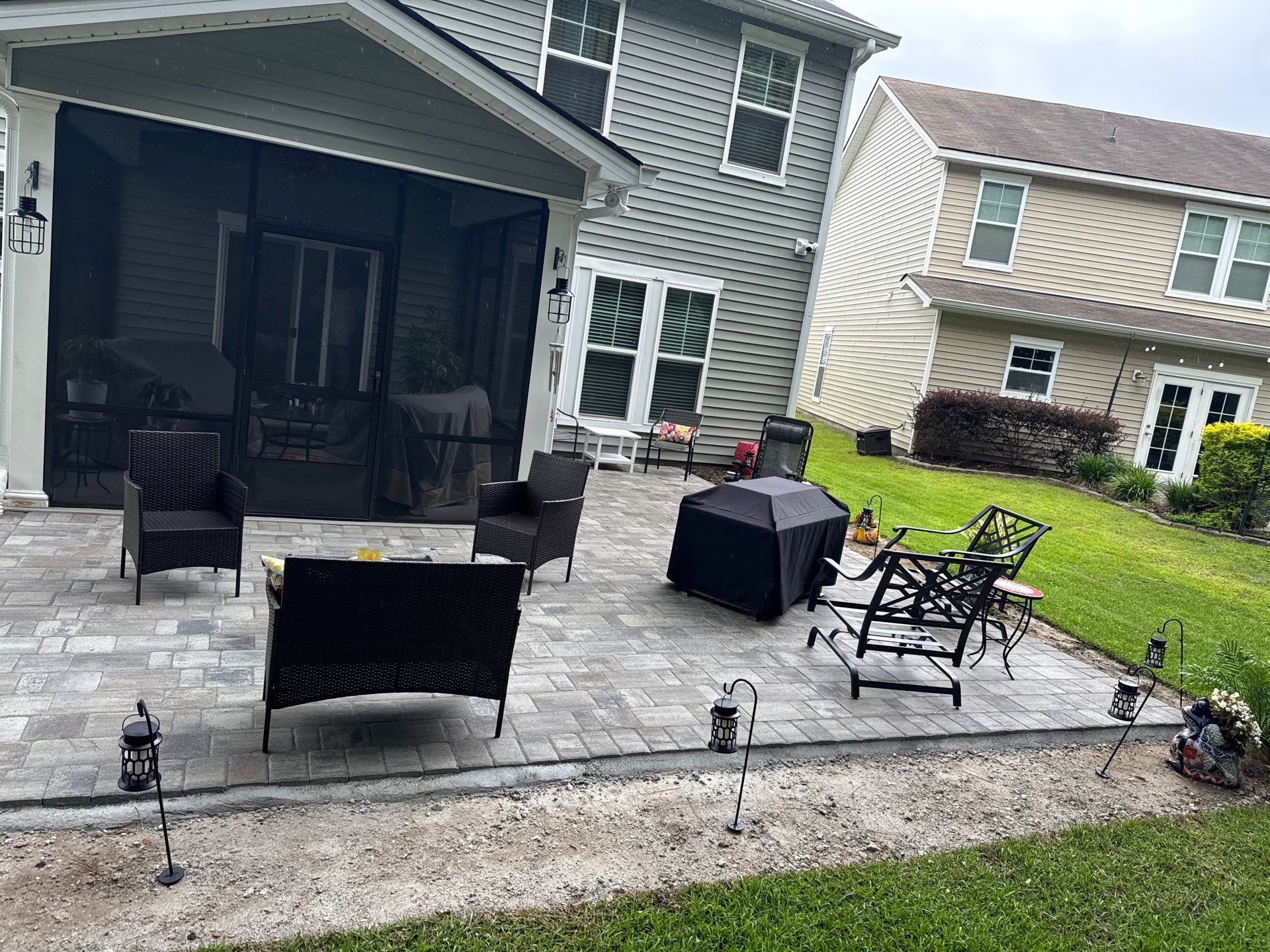 Custom Paver Patio Extension and Circular Fire Pit in Bluffton by Lowcountry Scapes, LLC