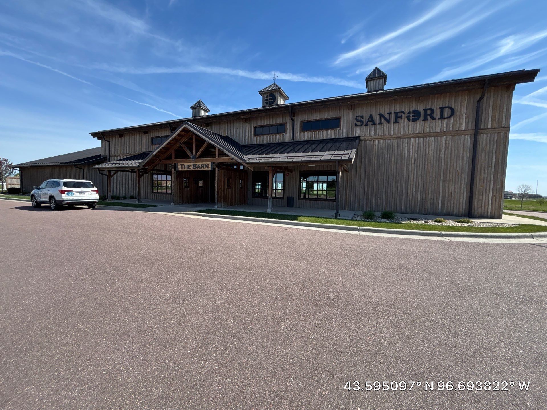 Commercial Exterior Wood Staining for Sanford Barn in Sioux Falls by Select Painting, Coatings & Garage Cabinets