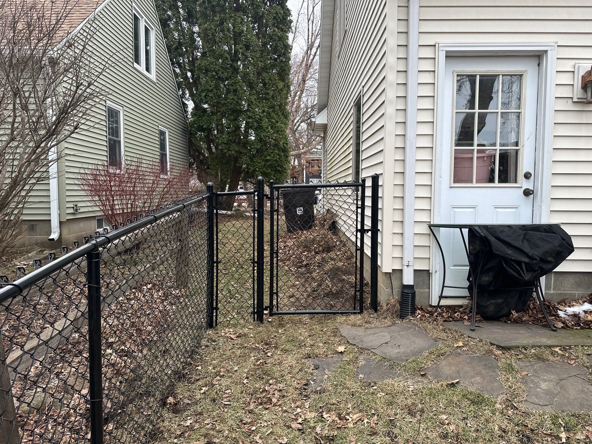 Black Vinyl Chain Link Fence Installation in Cedar Falls by Perfect Picket Fence and Stain