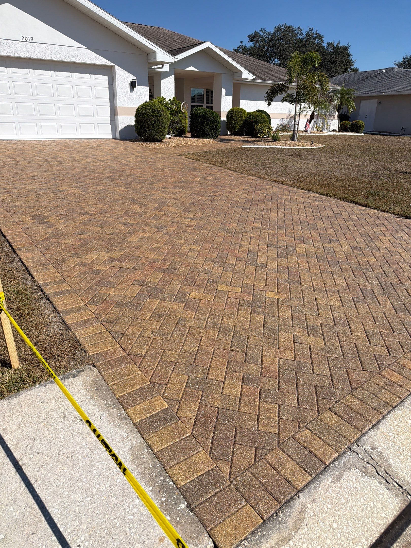 Restoring Herringbone Paver Driveway and Walkway in Sun City Center by Supreme Paver Experts