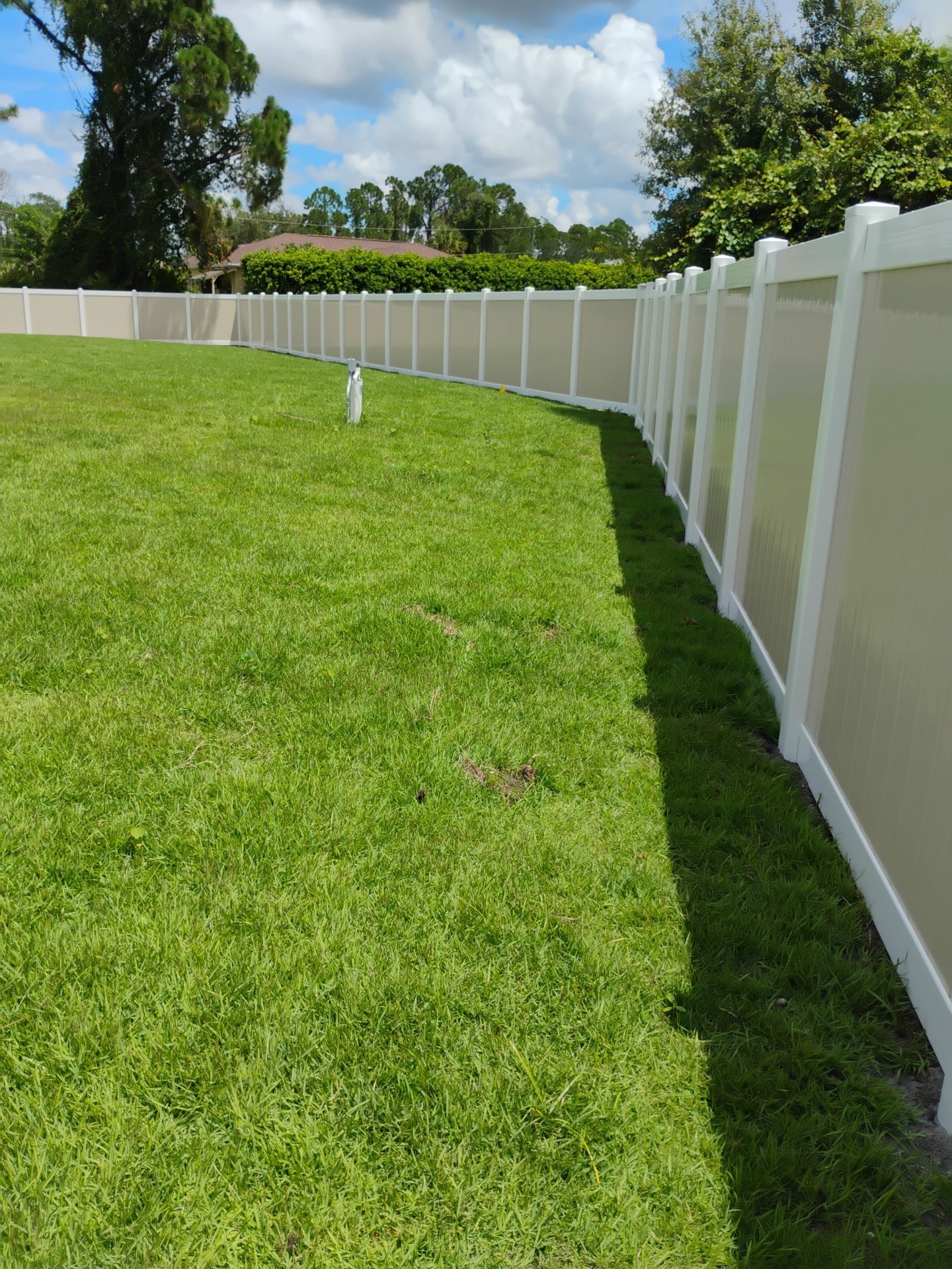 Custom Two-Tone Vinyl Privacy Fence Installation in North Port by True Fence LLC