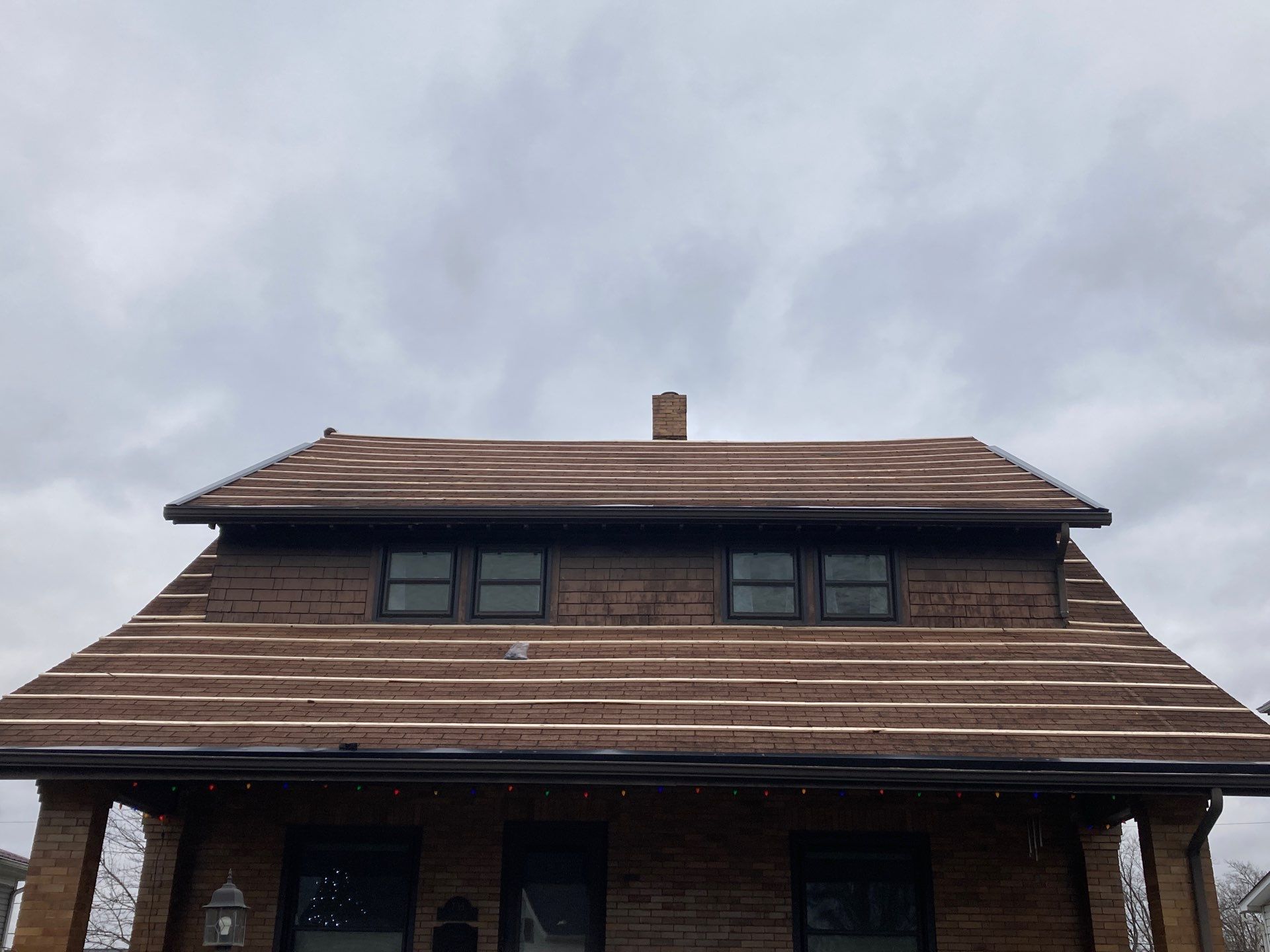 Residential Roofing Installation using Perfromance Panel Metal - Black by RoofX 
