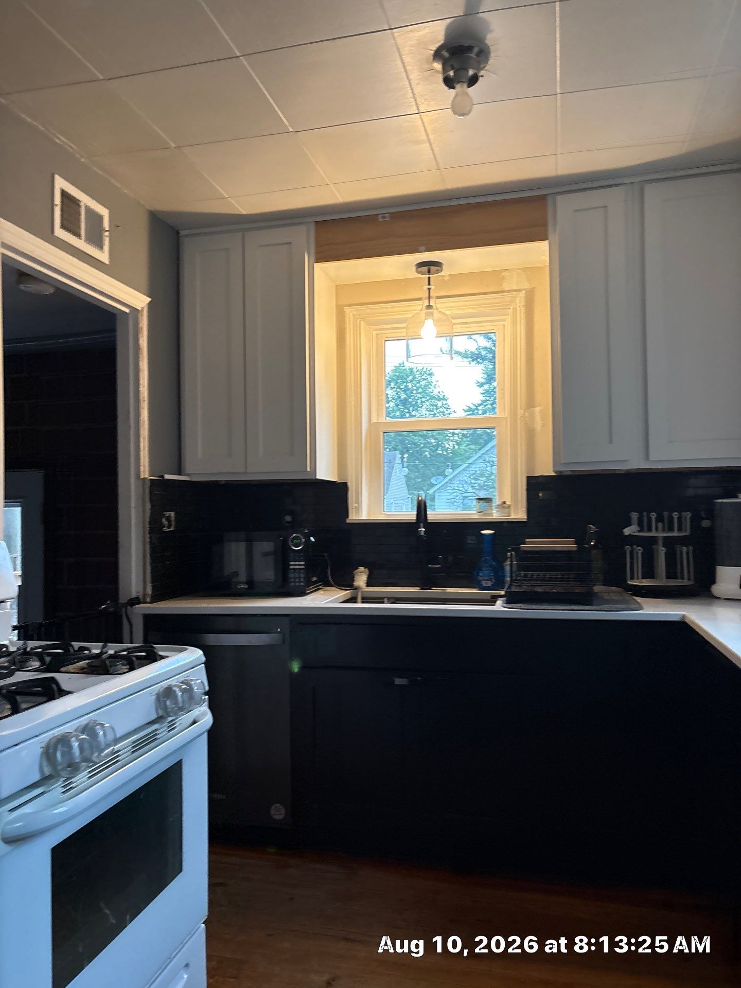 Modern Kitchen Renovation with Black and White Cabinetry in Lincoln by CompanyCam Sales Demo