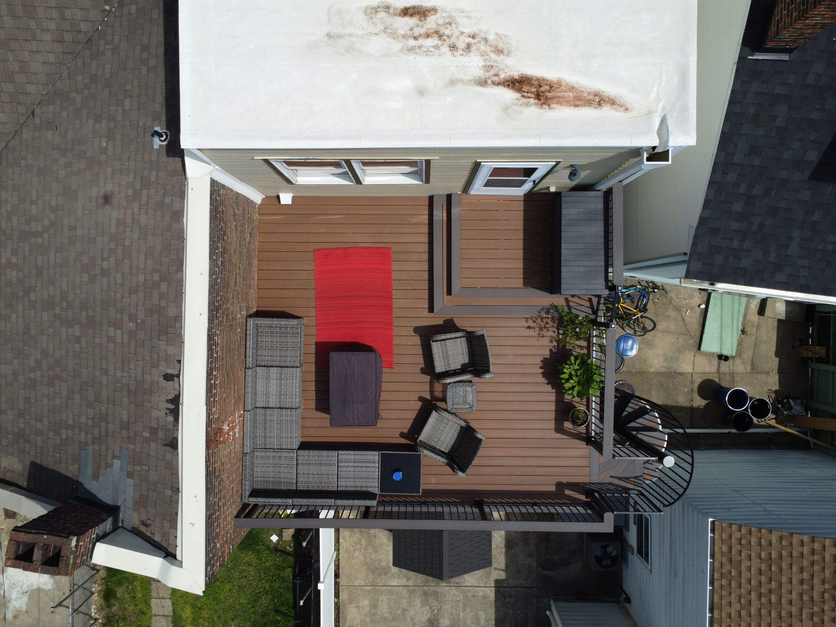 Elevated Multi-Level Composite Deck with Spiral Staircase in Pittsburgh by Cousins Roofing Siding & Decks