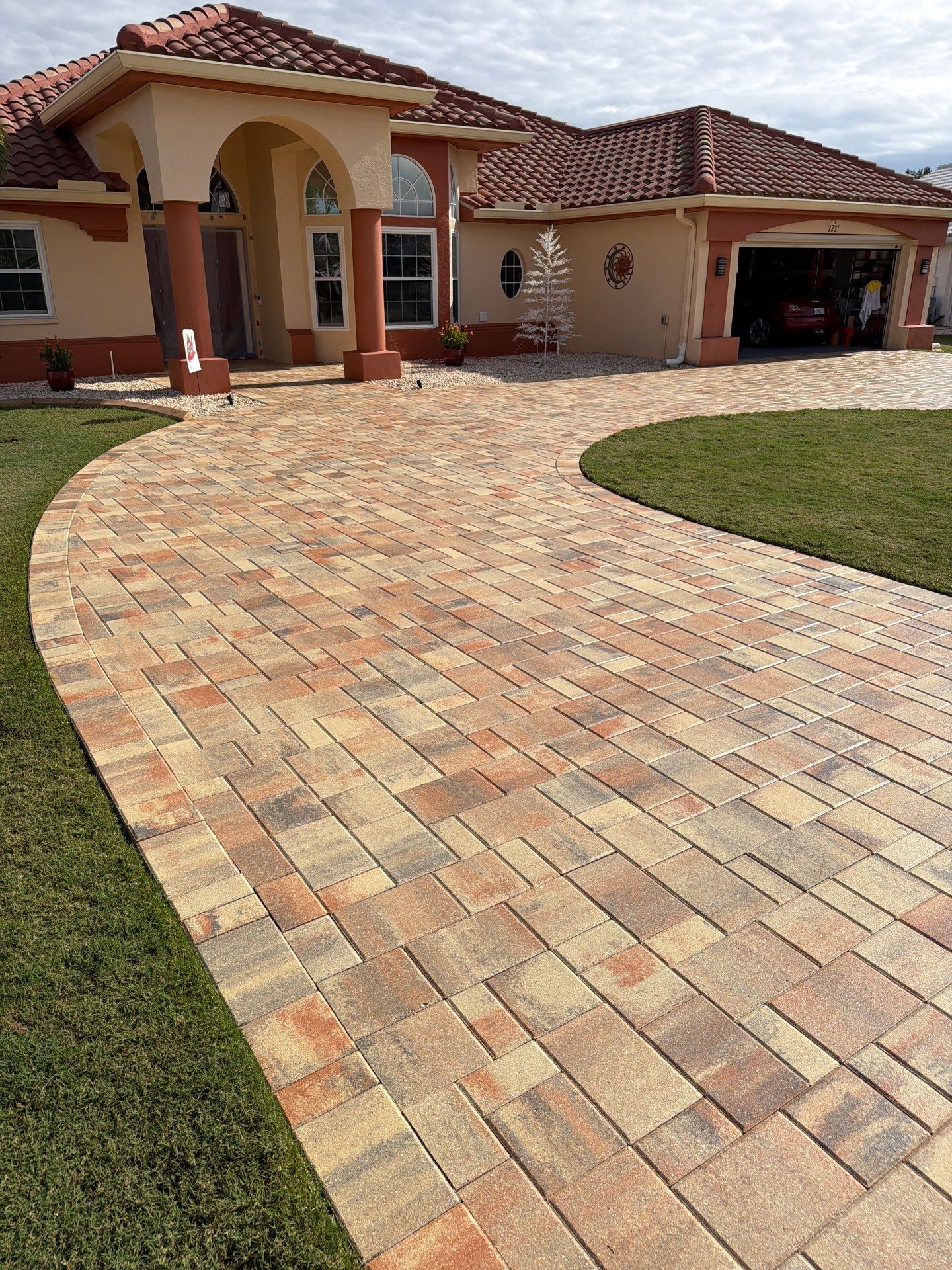 Professional Paver Sealing for this beautiful Driveway in Sun City Center by Supreme Paver Experts