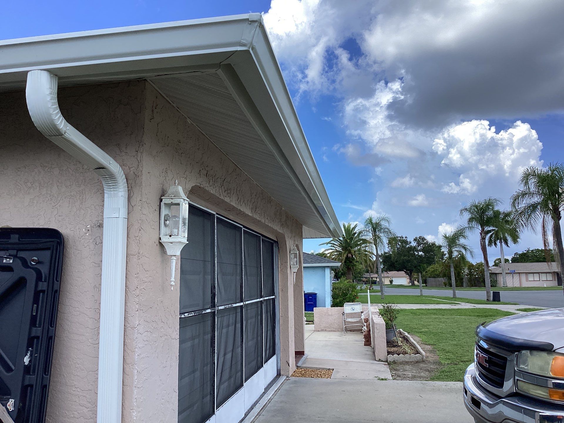White Seamless Gutters and Splash Guards in Fort Myers FL by Gutter Professor by Gutter Professors