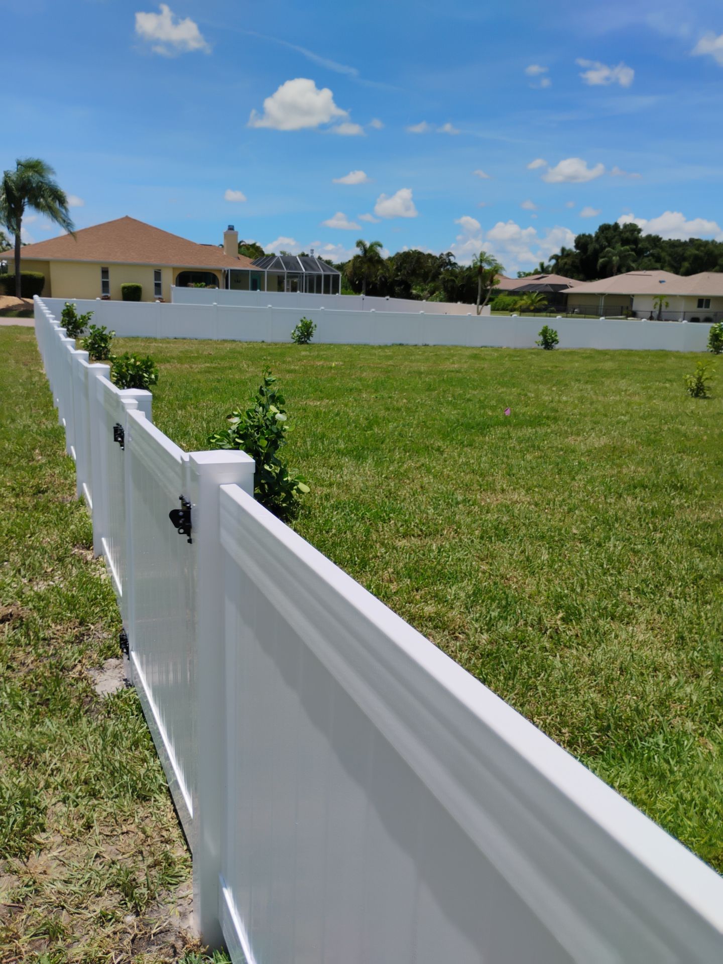 White Vinyl Privacy Fence Installation on Port Charlotte Corner Lot by True Fence LLC