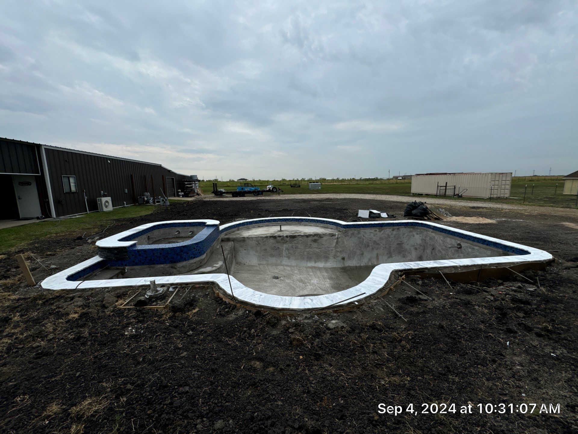 Freeform Pool with Raised Spa by Pinnacle Pools and Spas - DFW