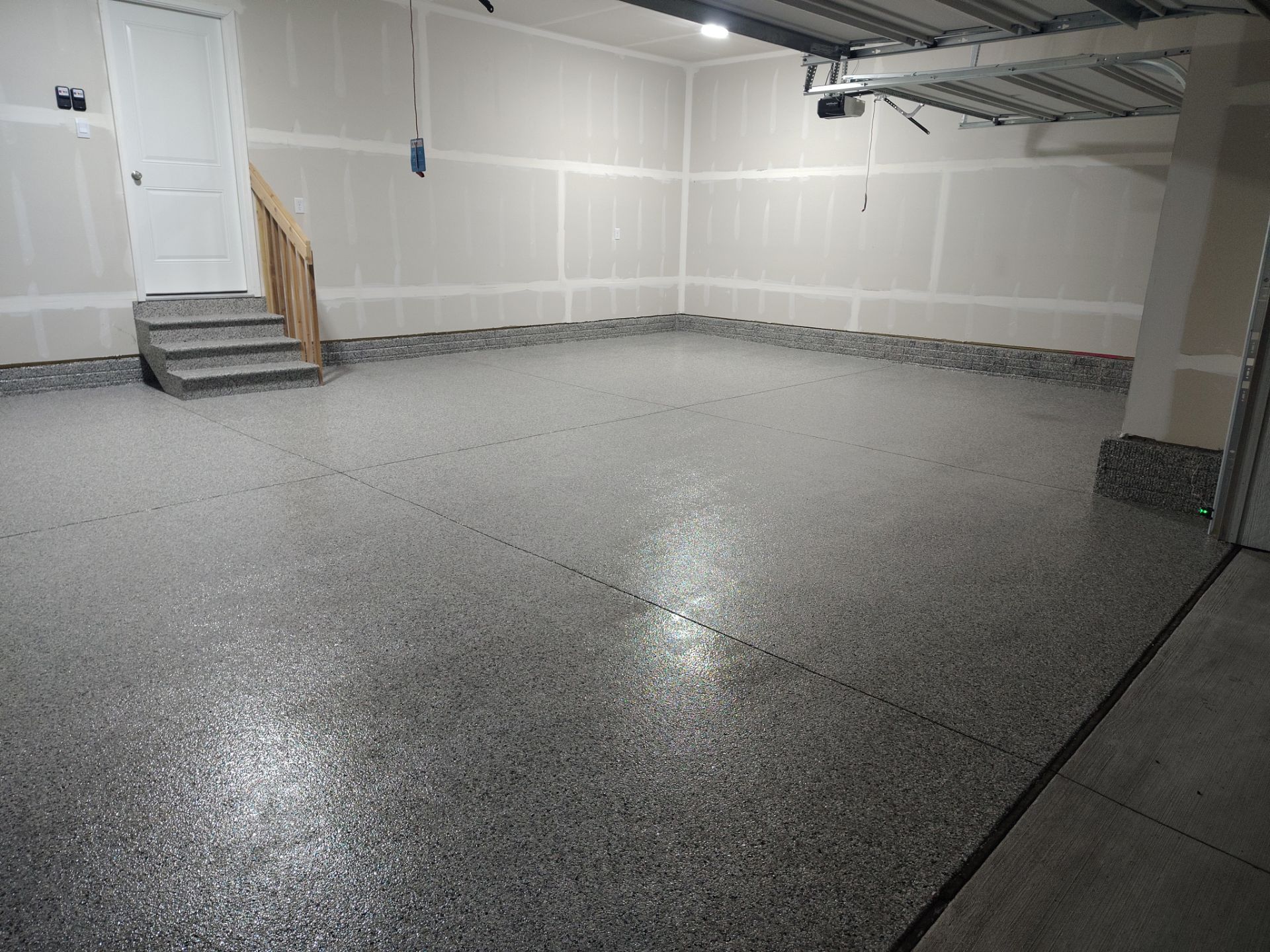 Adel, IA Garage: Complete Keystone Wrap on Floors, Stairs, and Stem Walls by Revival Concrete Coatings