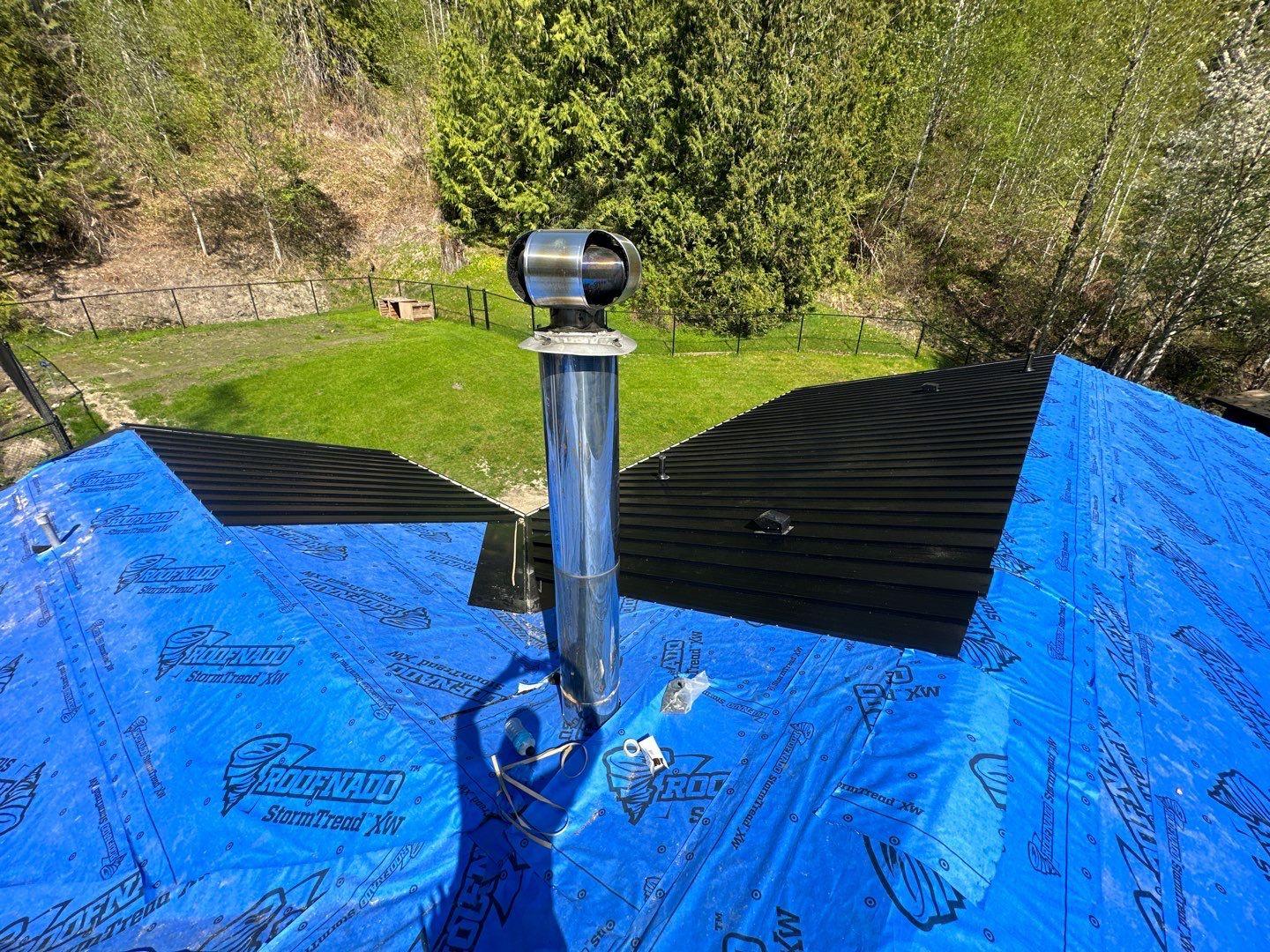 Residential ReRoofing Installation using 12" Prolok metal by Top Notch Roofing Inc