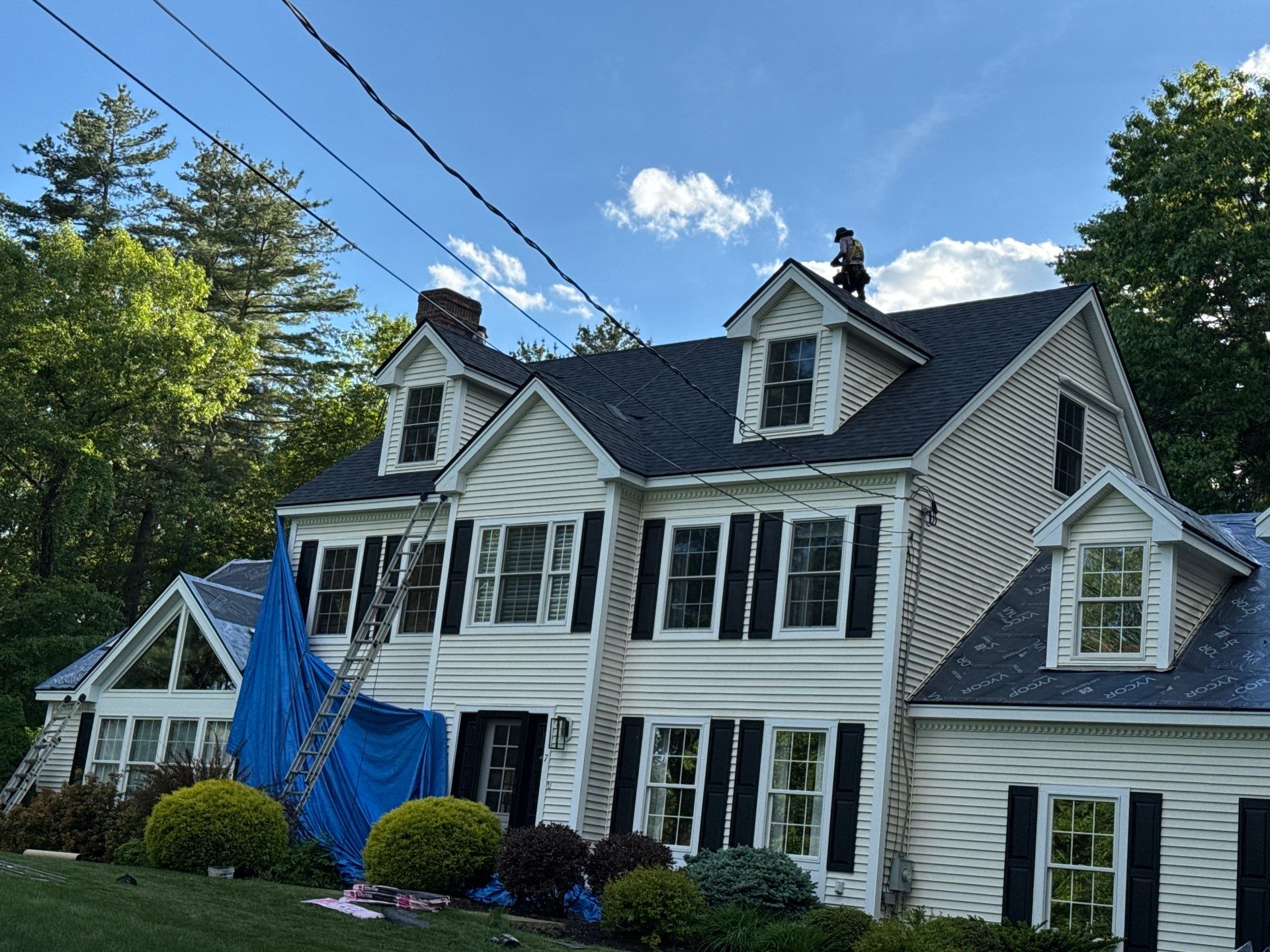 Roof Replacement on Cobbetts Pond in Windham, NH with Owens Corning Onyx Black Shingles by Compass exteriors