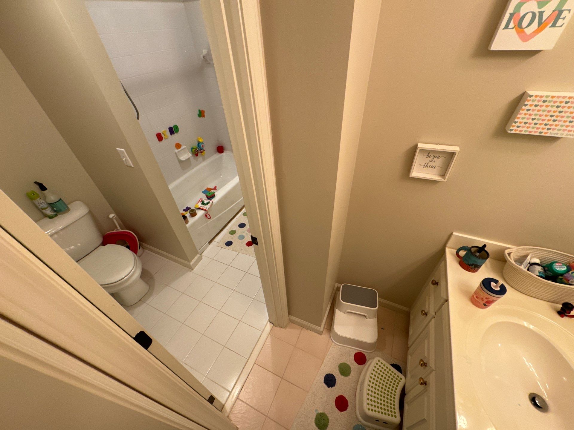 Tub retile, floor, vanities, mirror, and lights by Prudencio
