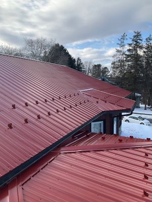 Red Metal Roofing Upgrade for Brick Home