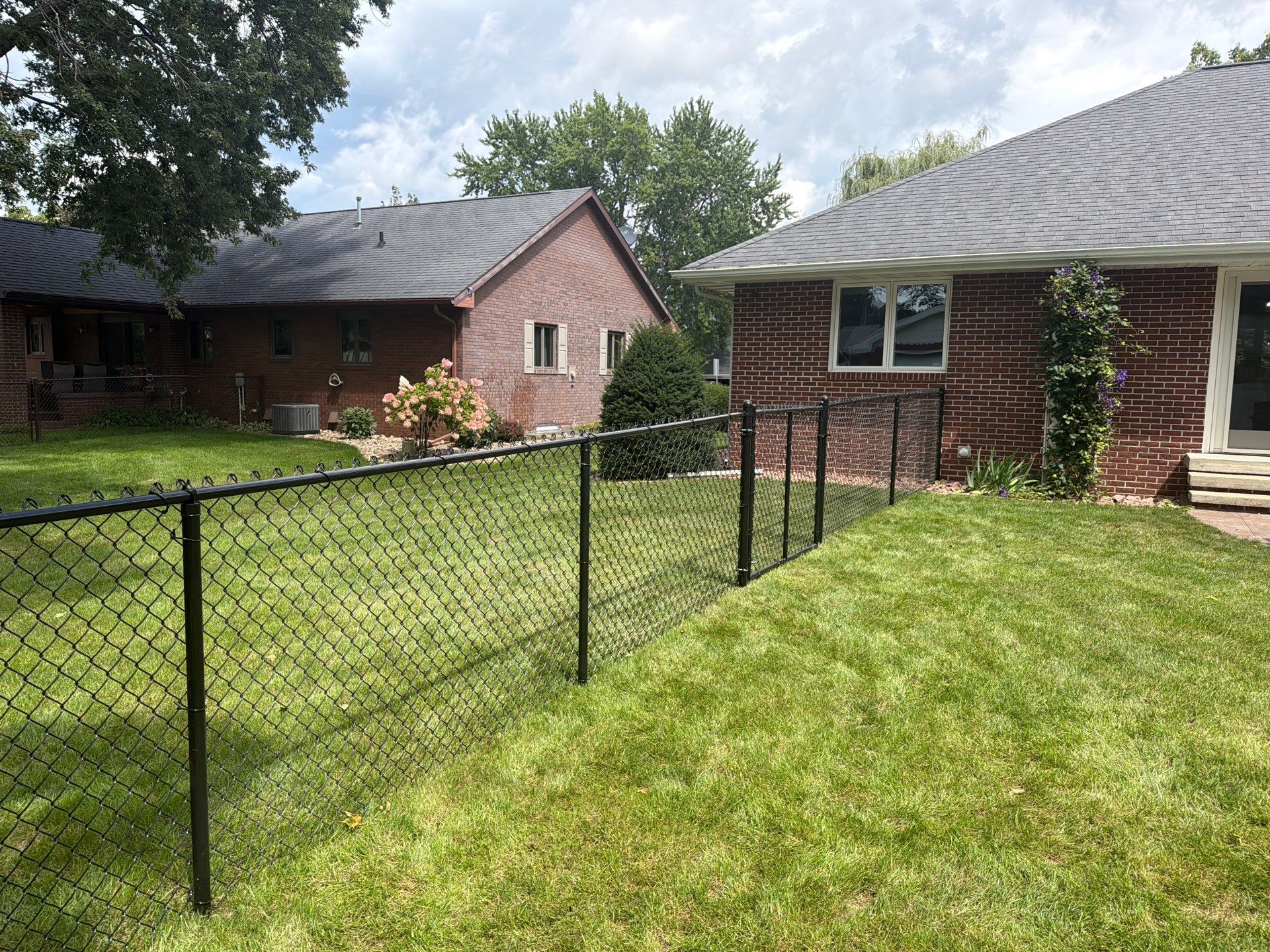 Residential White Vinyl Privacy and Black Chain Link Fencing in Jesup by Perfect Picket Fence and Stain