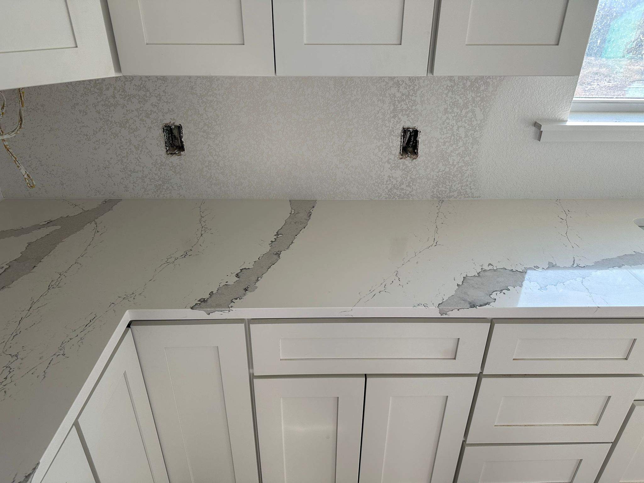 Kitchen and Bathroom Countertop Upgrades Featuring Gray Veined Quartz by Mena stone surfaces