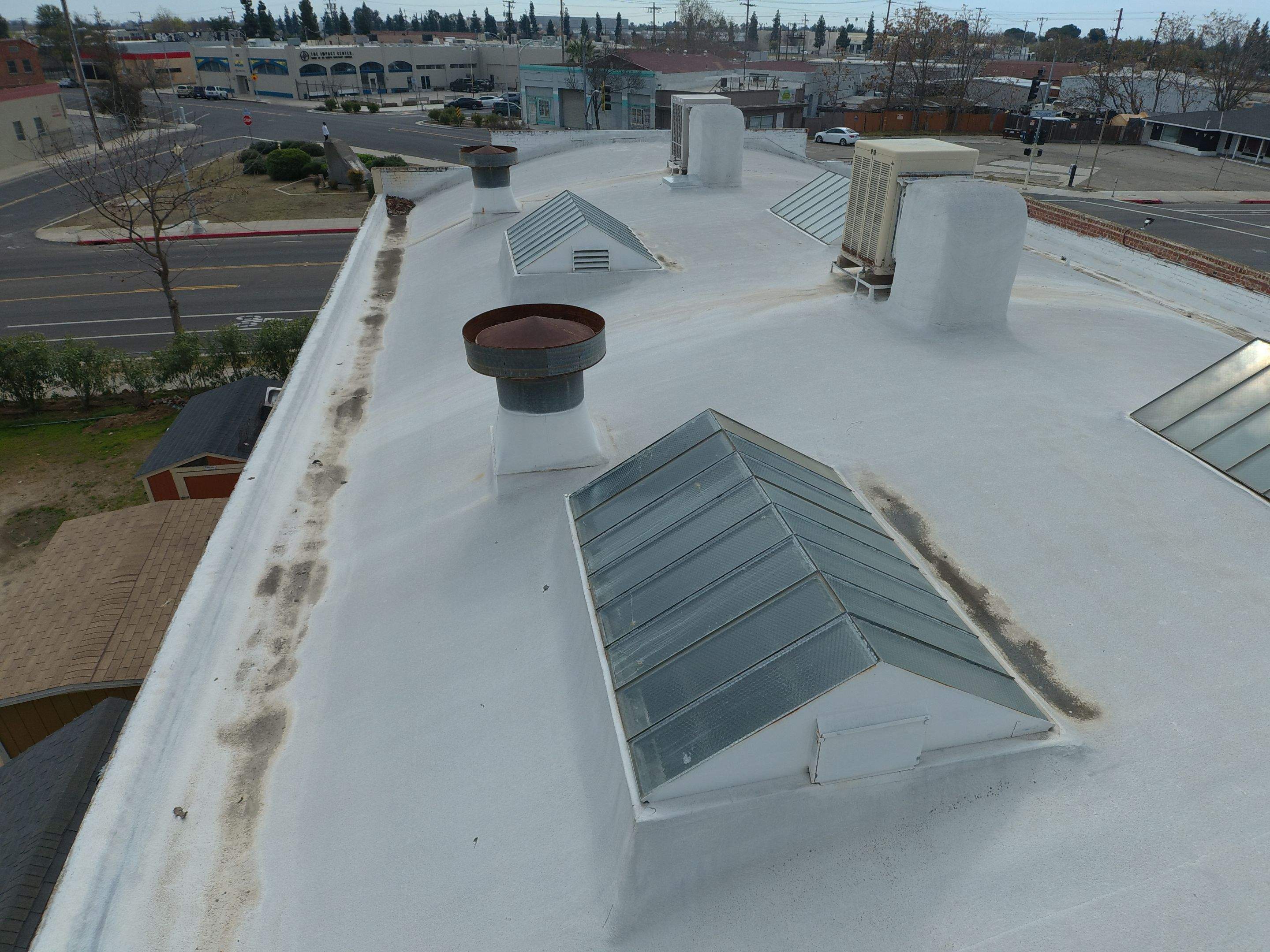 Polyurethane foam roof refurbish and recoating by Straight Edge Roofing Inc