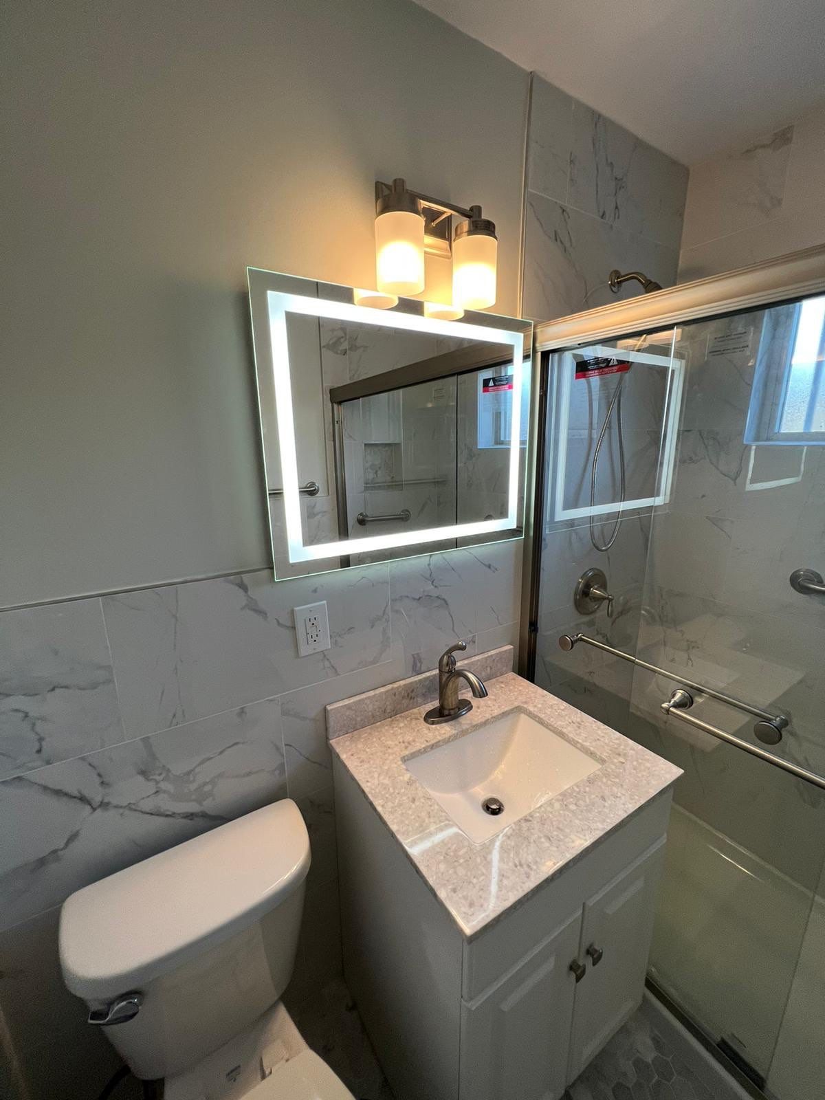 Bathroom Remodel using Tile by Home Concepts Construction