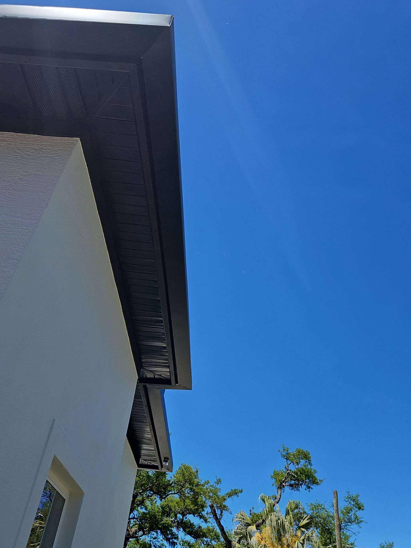 Soffit and Fascia Installation and black seamless gutters in Sarasota FL by Gutter Professors