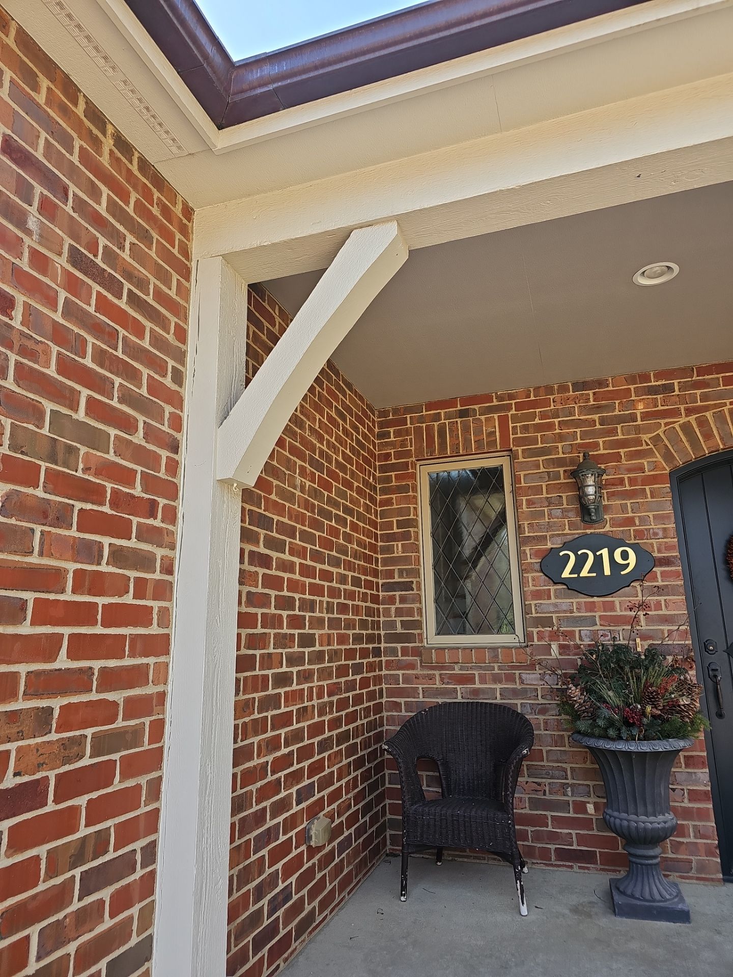 Residential Exterior Brick Painting and Limewash Refresh in Sioux Falls by Select Painting, Coatings & Garage Cabinets