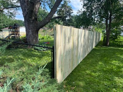 Custom Treated Pine Privacy Fence and Chain Link Installation in Cedar Falls