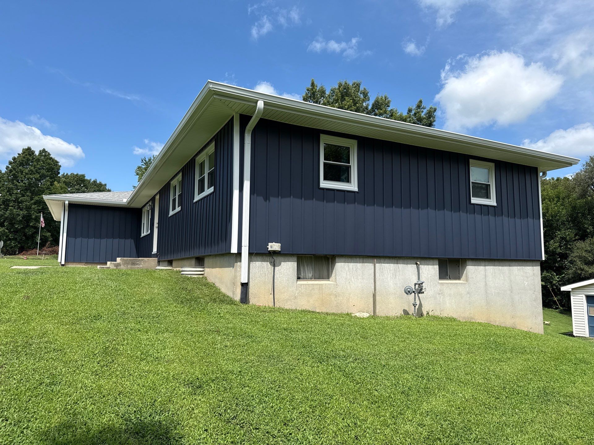 Indigo Board and Batten Siding and Window Replacement in Smithville by EEC Windows, Siding & Roofing