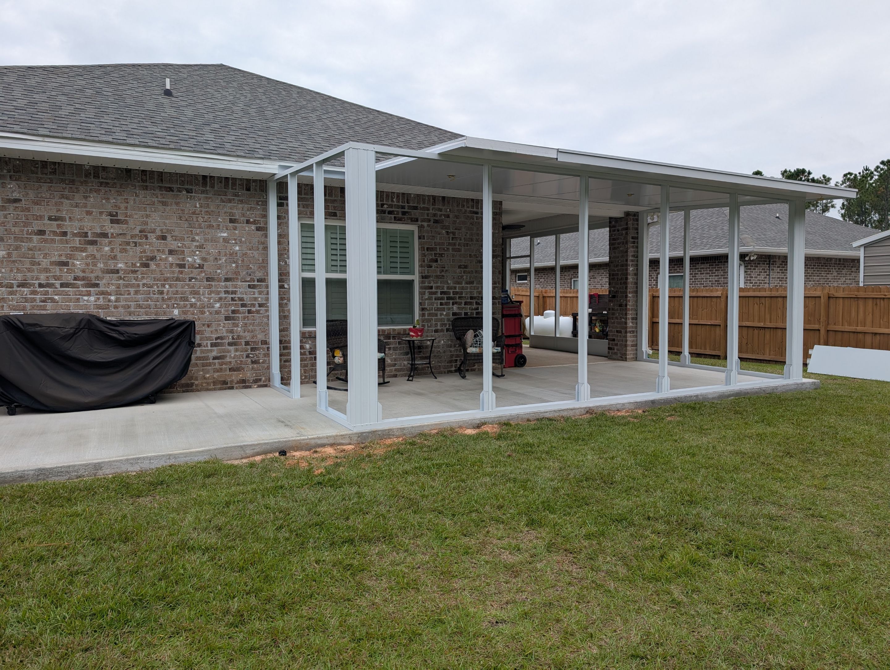 Home addition w/Vinyl 4-Track Windows by Titan Sunrooms