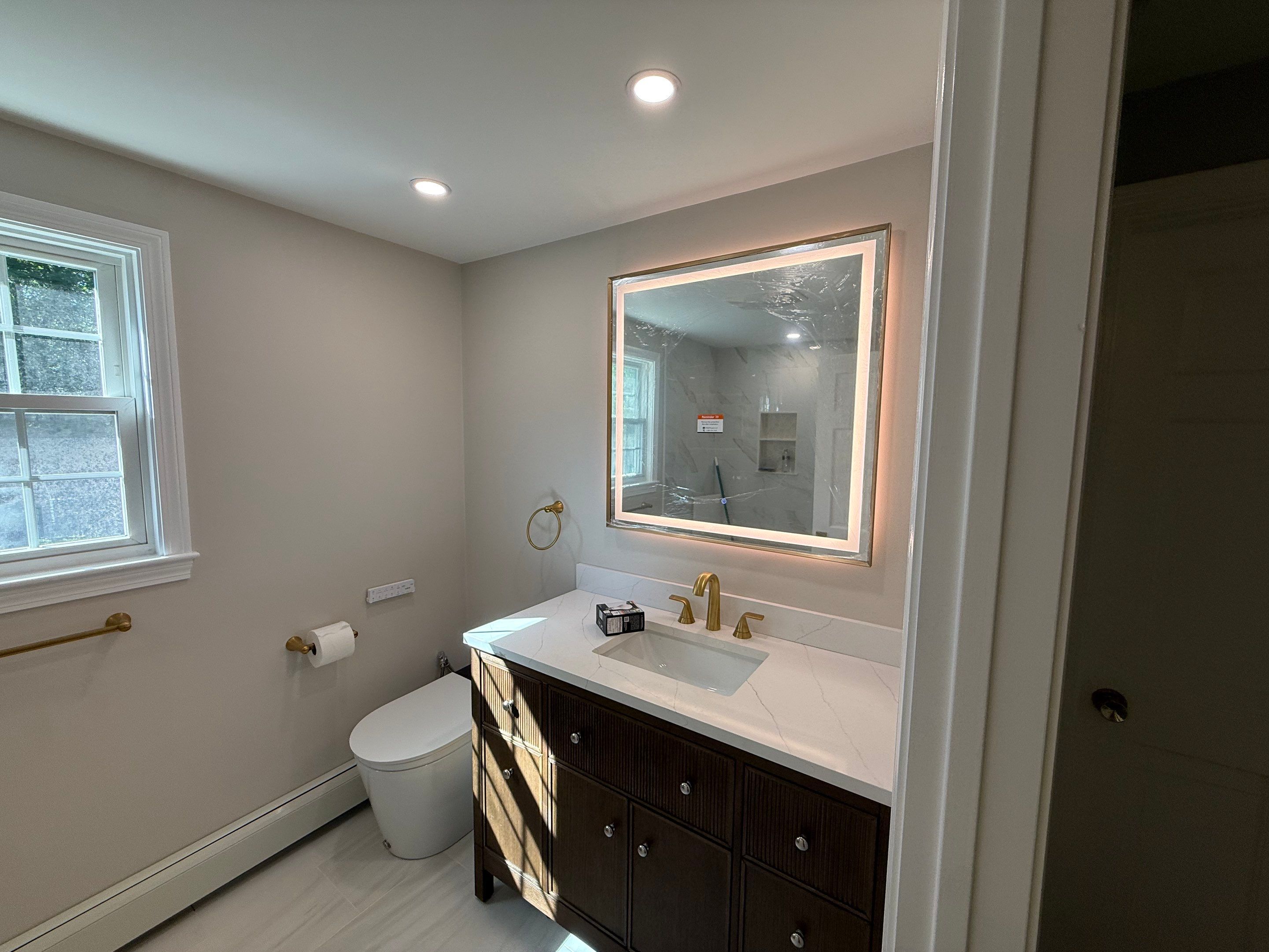 Bathroom renovation in Dedham, MA by Us Propaint And Renovation