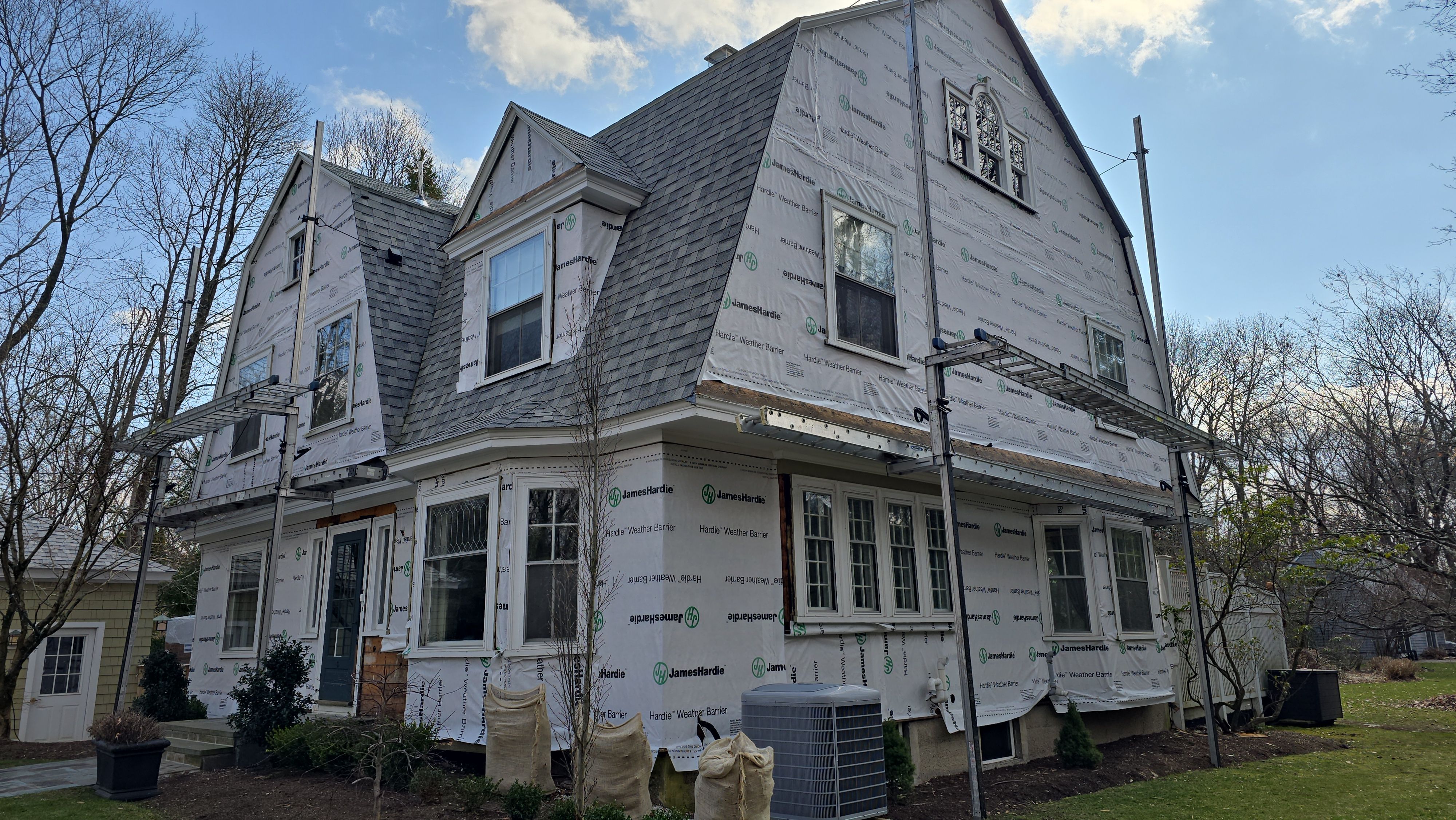 White cedar shingles and windows in Wayland, MA by UBrothers Construction