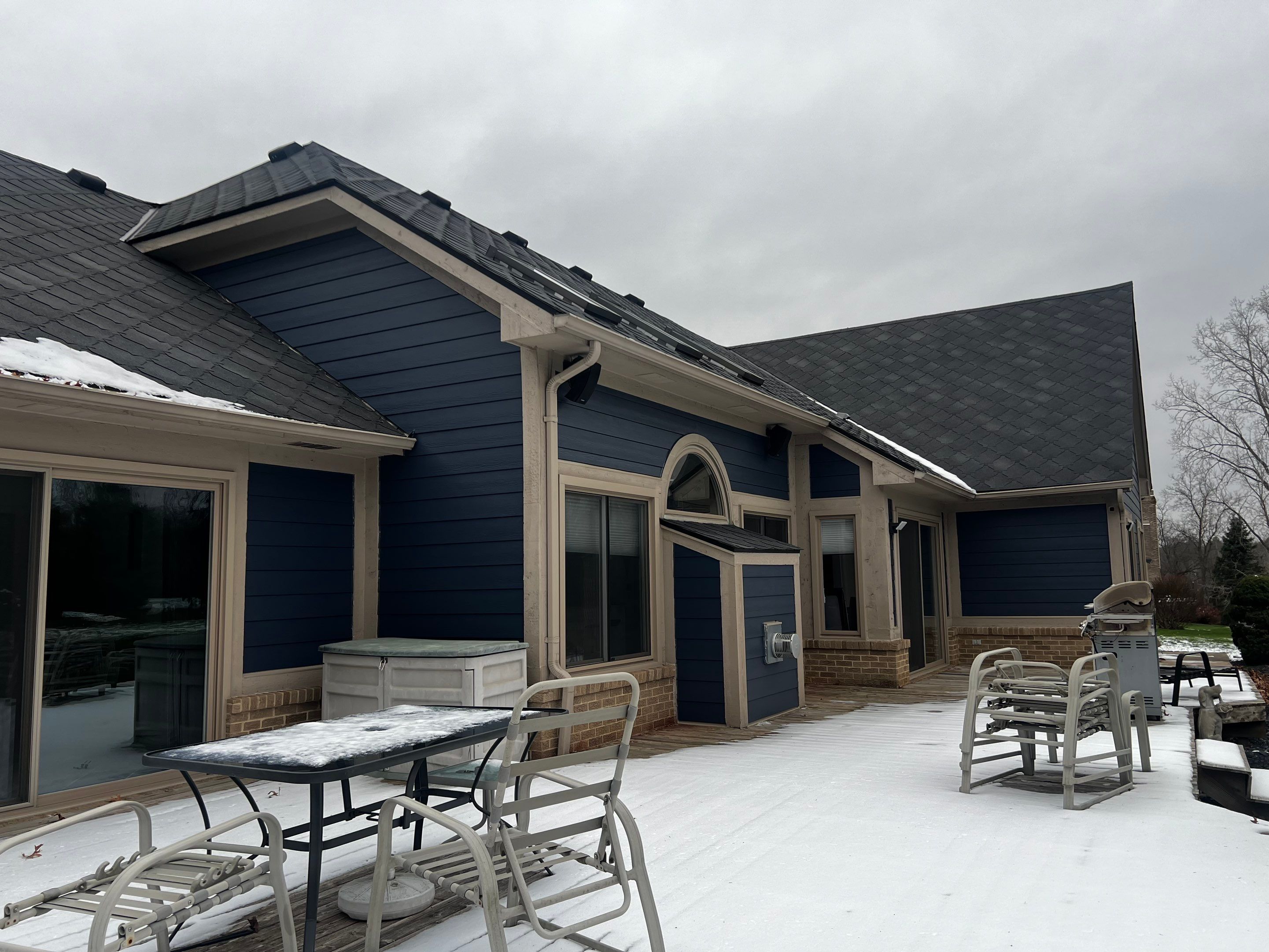 Siding Replacement using James HardiePlank Cedarmill in Deep Ocean color by Bloomfield Construction & Restoration