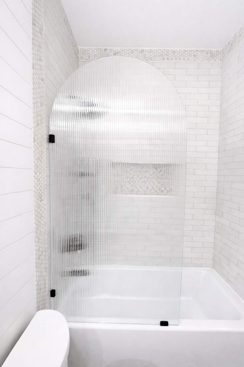 Stone Oak Hall Bathroom Remodel with Pink Vanity and Curved Shower Glass by Legacy Bath and Kitchen