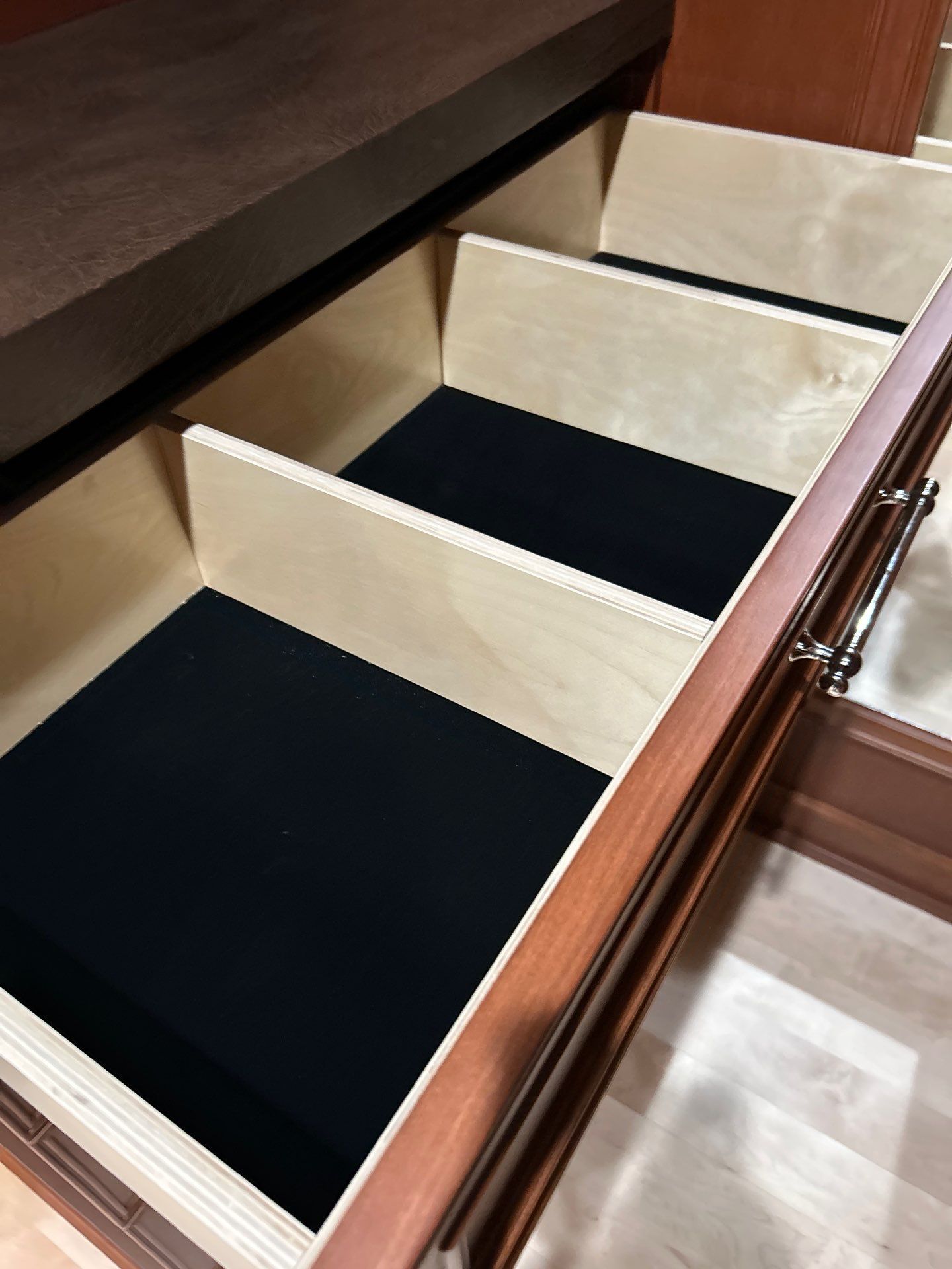 Stained Cherry Wood Primary Closet by Concept 32, Inc.
