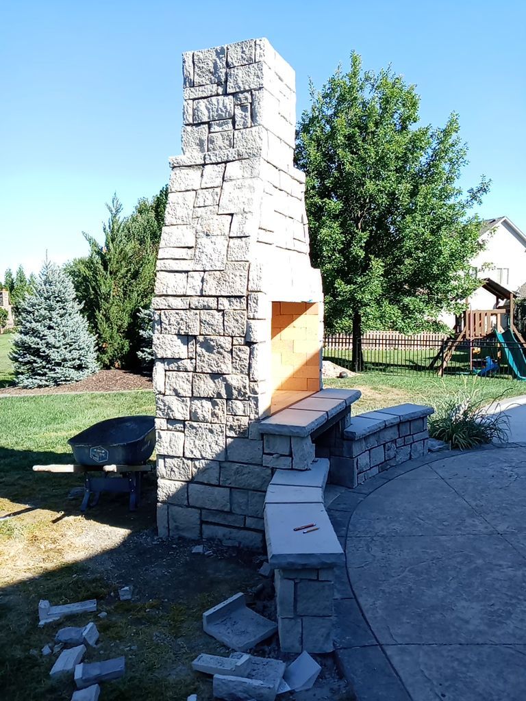 Back Yard Fireplace and Landscape by LAND ESCAPES LLC