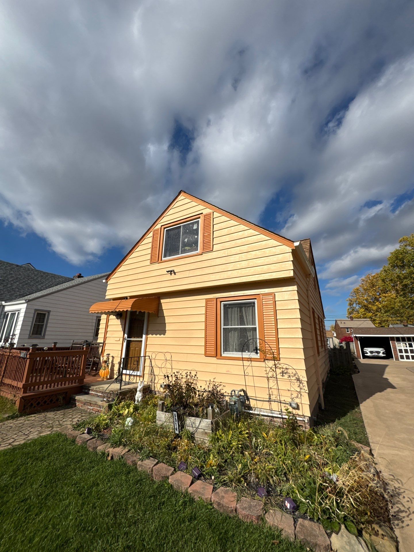 Full Exterior Siding and Awning Transformation in Parma by Cornerstone Roofing And Siding