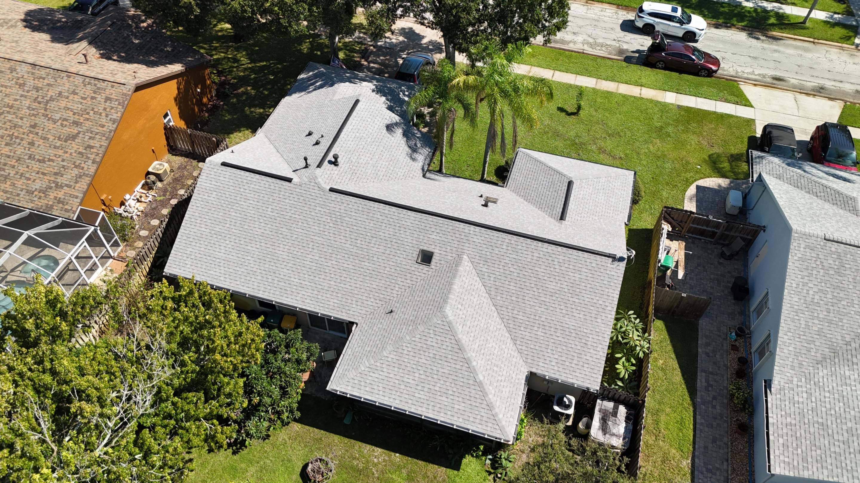 Comprehensive Roof Replacement w/ Old English Pewter Shingles & Black Ridge Vent in Melbourne by Wiedmann Construction & Roofing