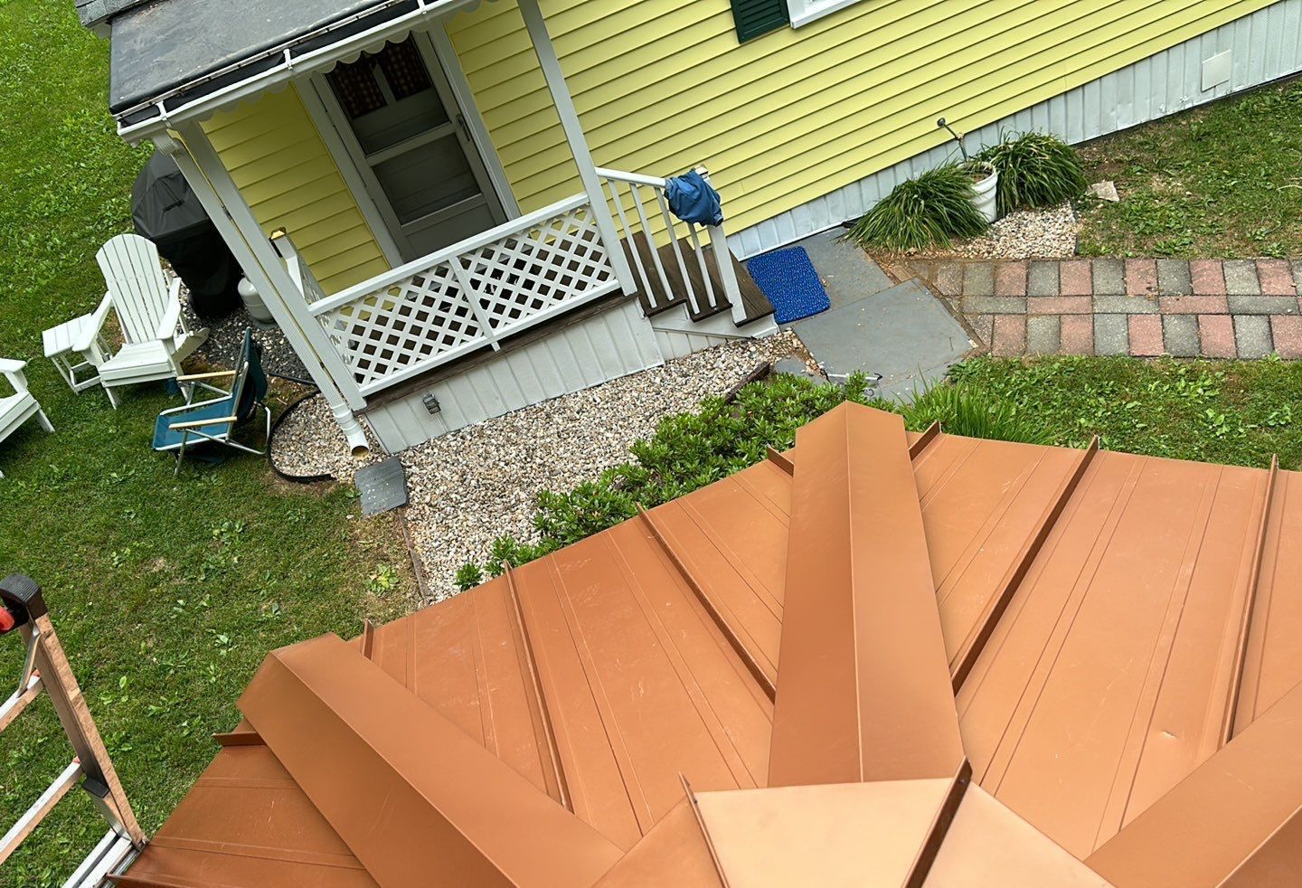 Residential Roofing Installation using Copper Penny Metal Roof by A Plus Exterior