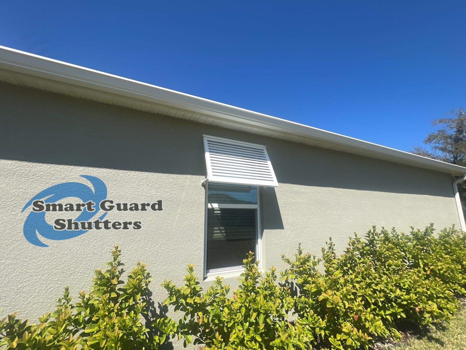 Decorative Bahama Shutters in Signal White by Smart Guard Shutters