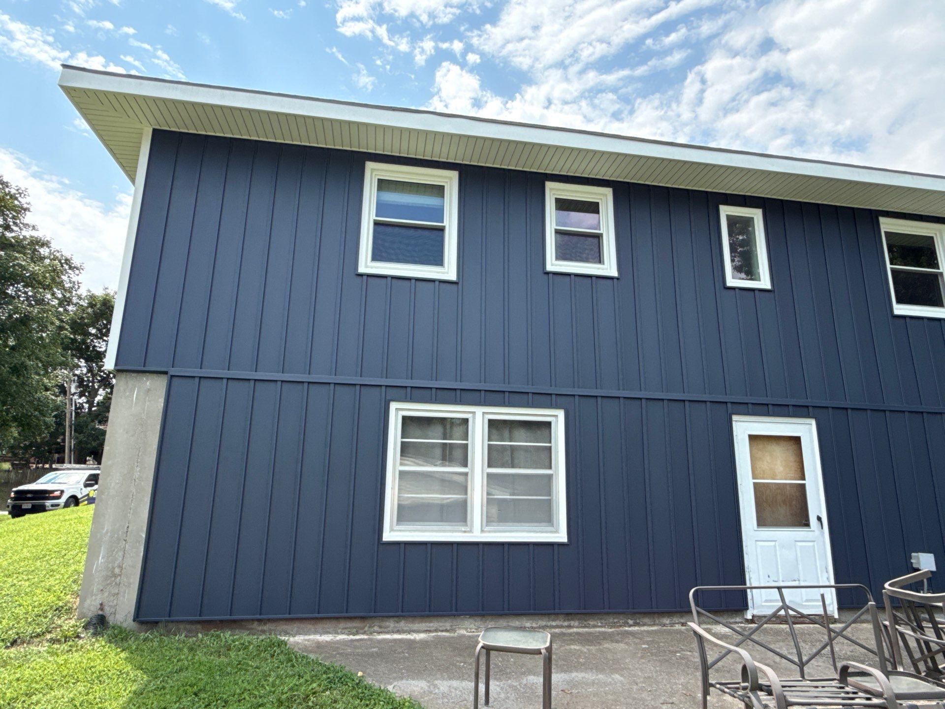 Indigo Board and Batten Siding and Window Replacement in Smithville by EEC Windows, Siding & Roofing