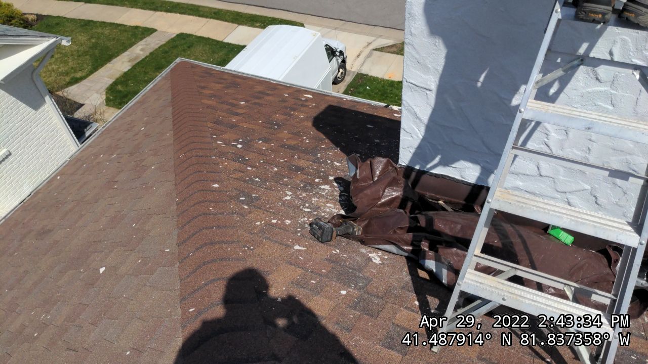 Residential Roofing Installation, Dec-tek walk-out porch roof, siding on garage by Absolute Roofing and Construction