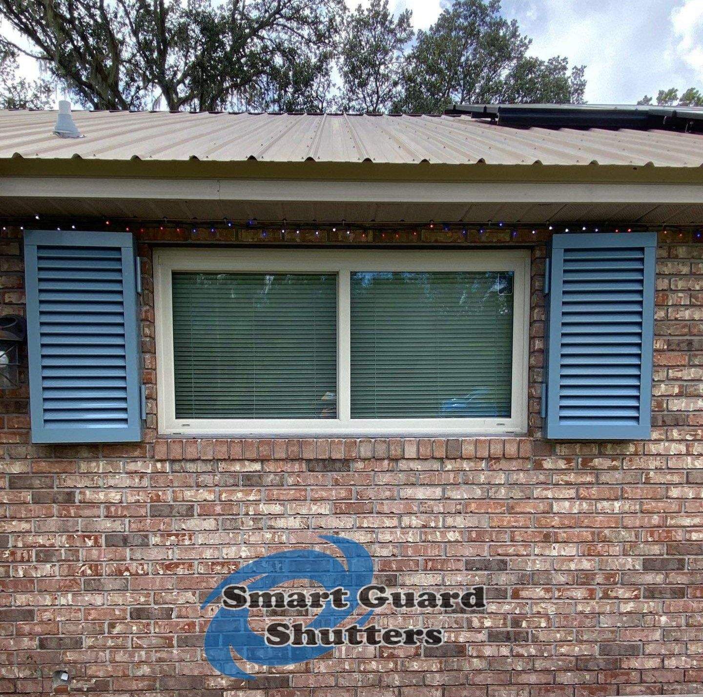 Impact Colonial Shutters in Squirrel Grey by Smart Guard Shutters