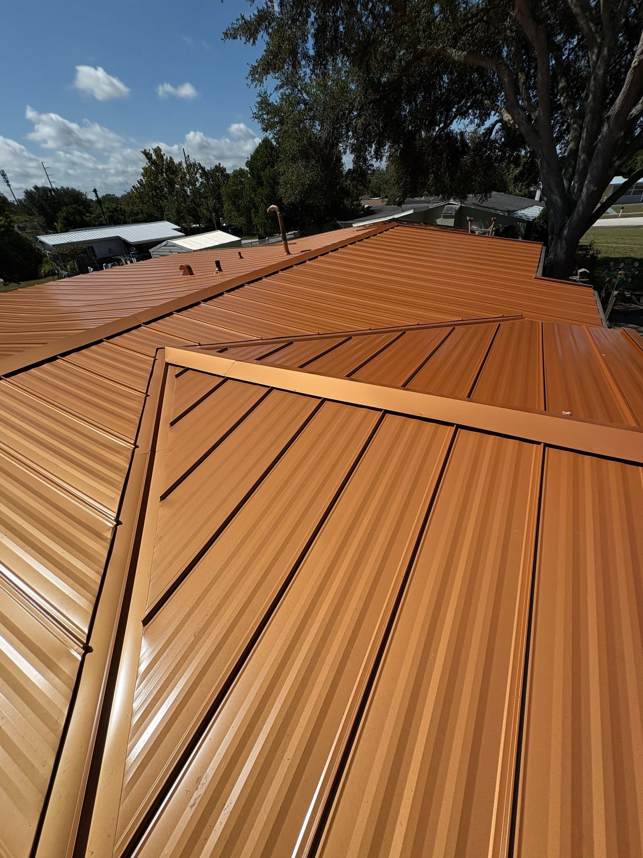 Standing Seam Metallic Copper Metal Roof Replacement in Deltona by Pinnacle Roofing Group
