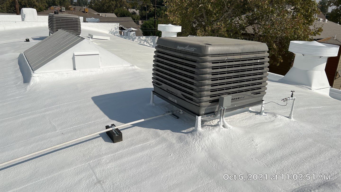 Polyurethane foam roof refurbish and recoating by Straight Edge Roofing Inc